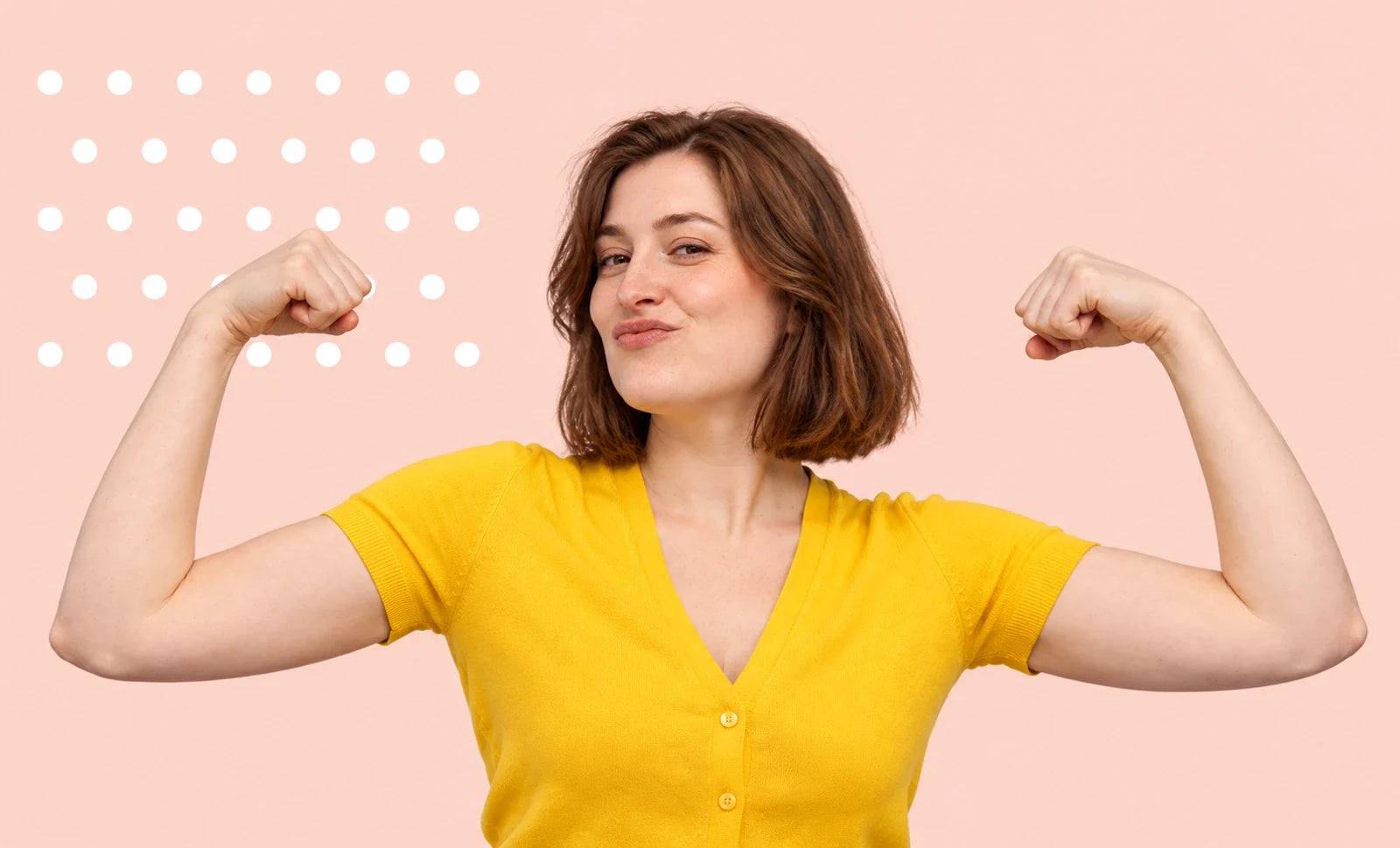 A confident woman in yellow flexing both arms