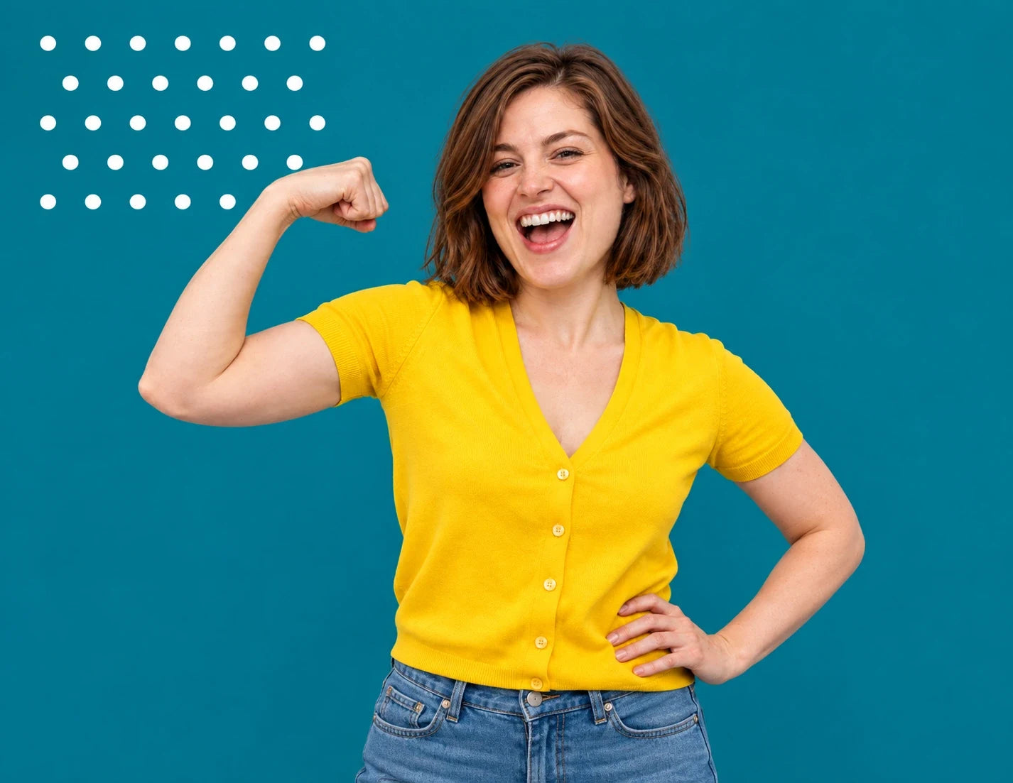 A joyful woman flexing her arm against a teal background