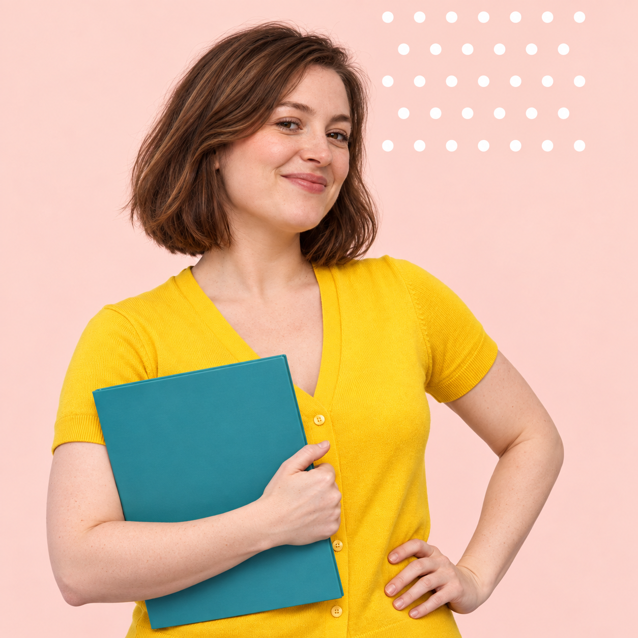 Woman in yellow holding a teal folder with a confident smile