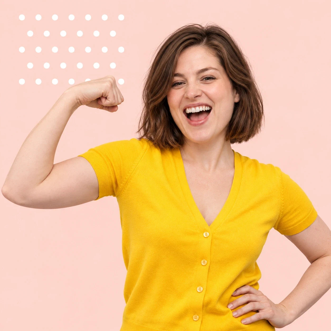 A smiling woman in yellow confidently flexing her arm